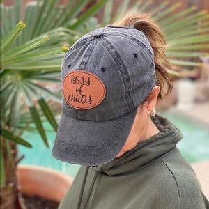Vintage washed black pony tail hat for women. Boss of chaos leatherette patch